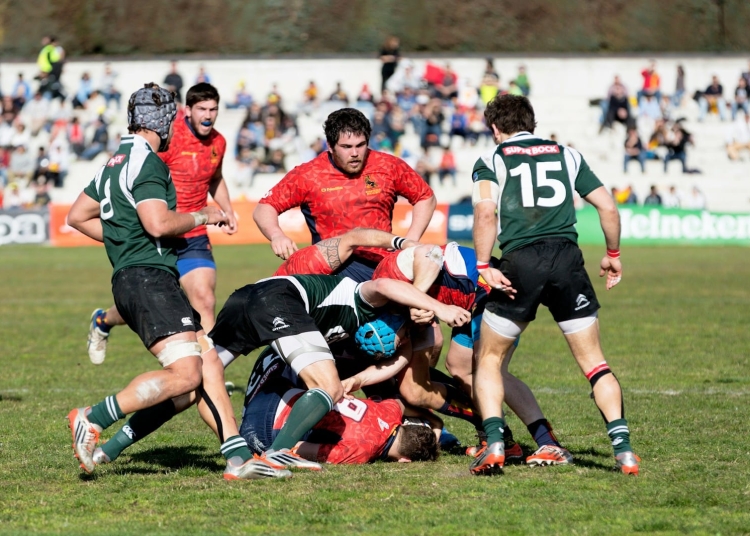 men playing rugby football