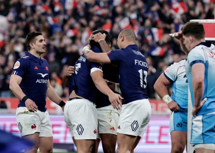France's centre Yoram Moefana (C) celebrates with teammates after scoring the team's first try during the Six Nations international rugby union match between France and Scotland at Stade de France in Saint-Denis, Paris' suburb, on March 15, 2025. (Photo by STEPHANE DE SAKUTIN / AFP)
